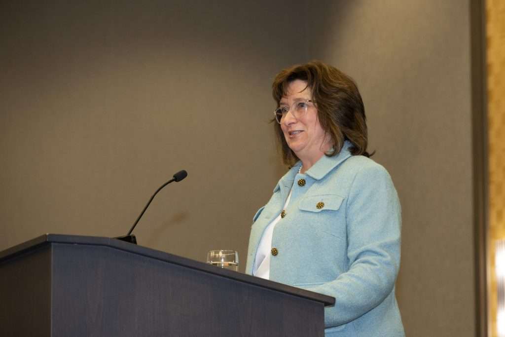 Maureen at the podium at the AFP event